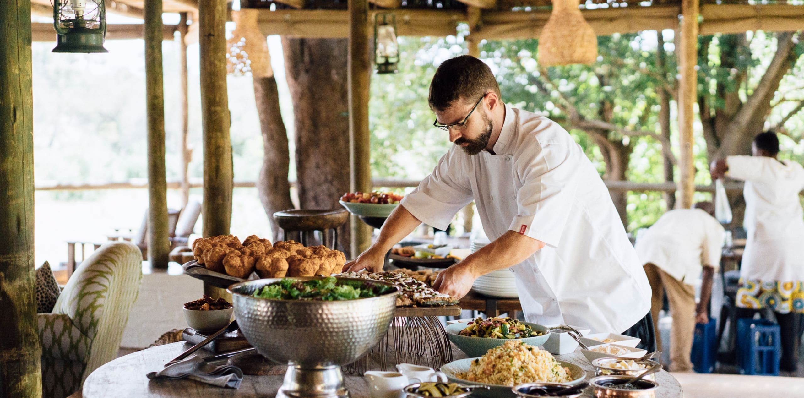 Chef preparing a fresh safari dining spread at Tanda Tula Safari Camp in the Timbavati Game Reserve.