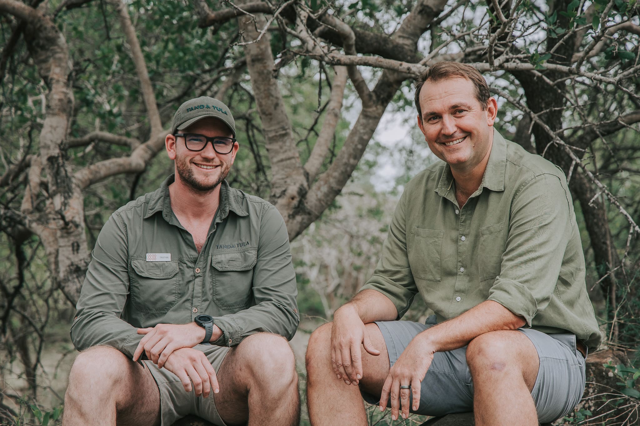 Field guides Tristan Allan-Reynolds and Dale seated together in the Timbavati bush at Tanda Tula.